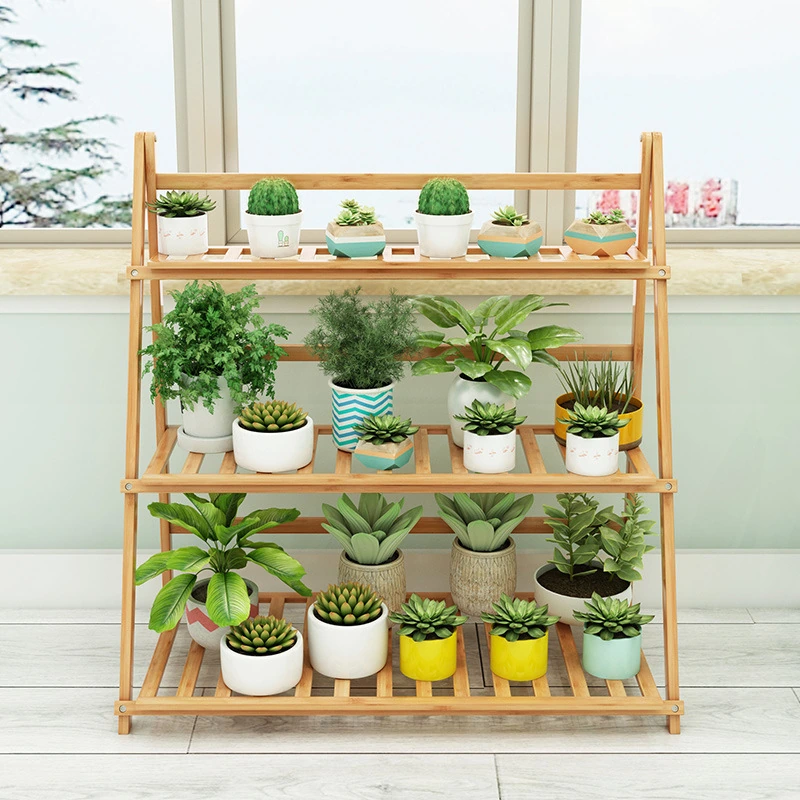 Natural bamboo three-tier stand displaying potted plants; pots and plants are not included