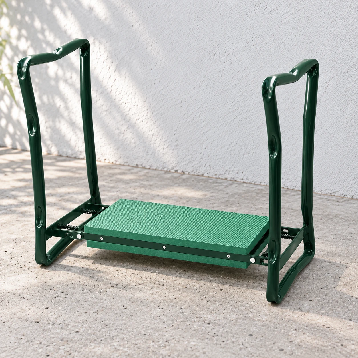 Green garden kneeler viewed from an elevated side angle